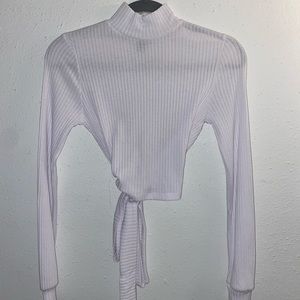 Cropped open back long sleeve turtle neck. Lightly used I’ve only worn once.
